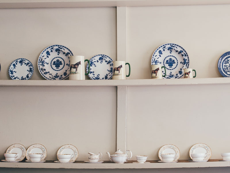 Light colored cabinetry and open shelving